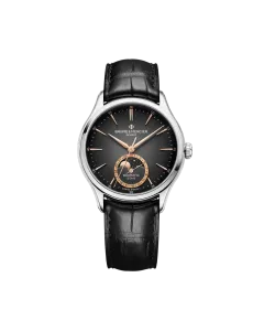 Baume & Mercier Clifton er en dressklokke med månefase til herre på 39 mm. Kasse i stål og rem i alligatorskinn. 50 meter vanntett.