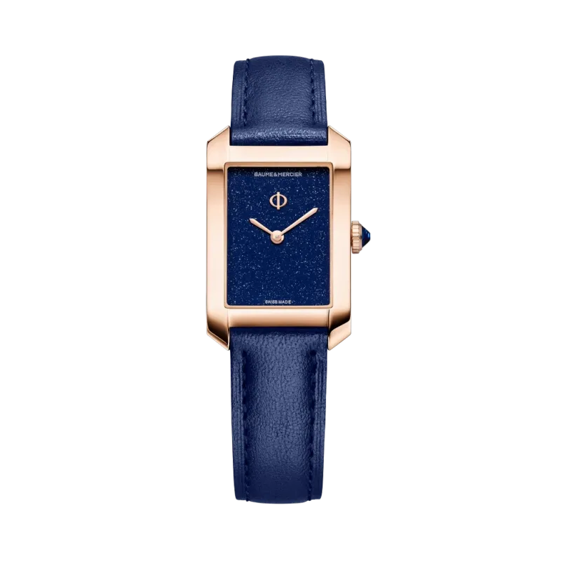 Baume & Mercier Hampton 10674 er en rektangulær dameklokke - en gullklokke med blå rem. 50 meter vanntett. Baume & Mercier Hampton 10674 er en rektangulær dameklokke - en gullklokke med blå rem. 50 meter vanntett.